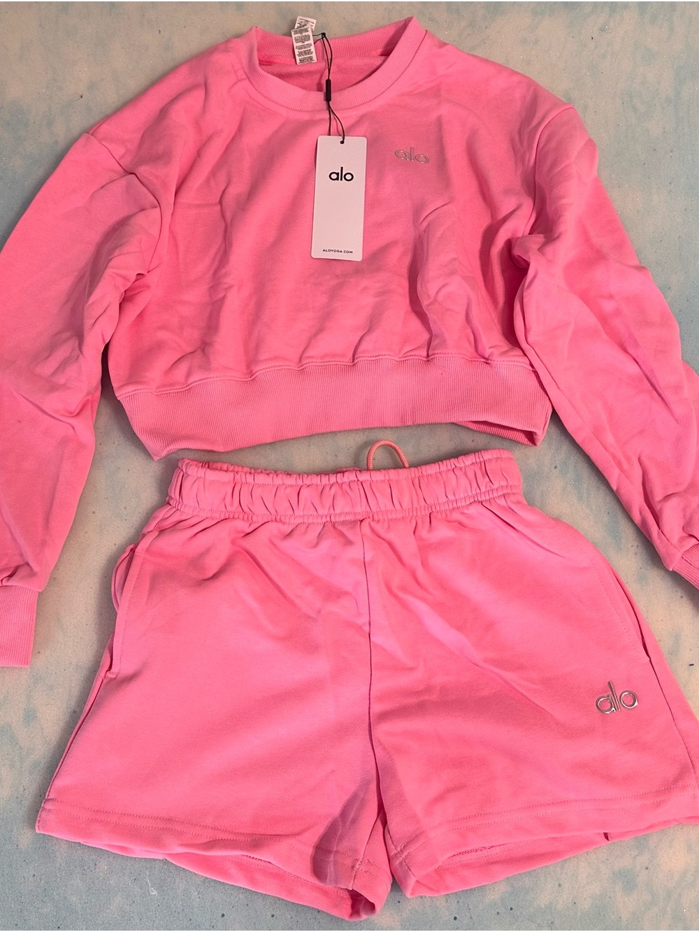 Cute pink crewneck and shorts active wear/lounge set.